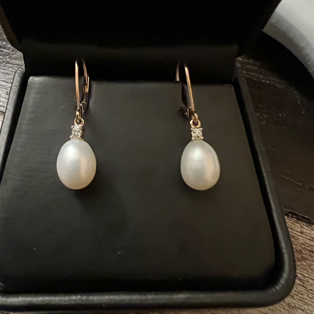 10k gold pear and diamond earrings.